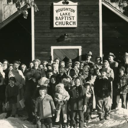 The congregation outside the original Houghton Lake Baptist Church building